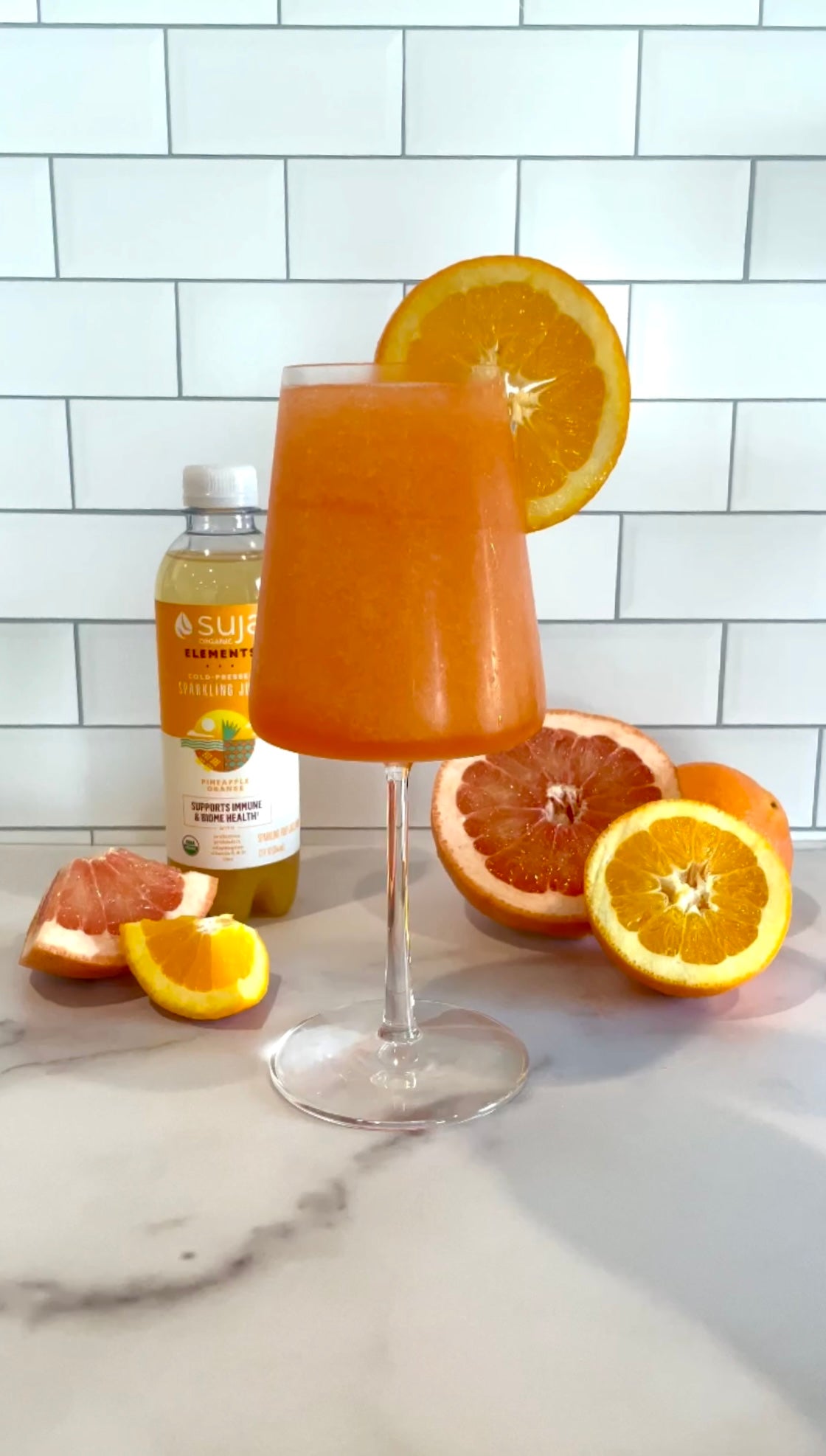 A Suja cocktail with Aperol spritz