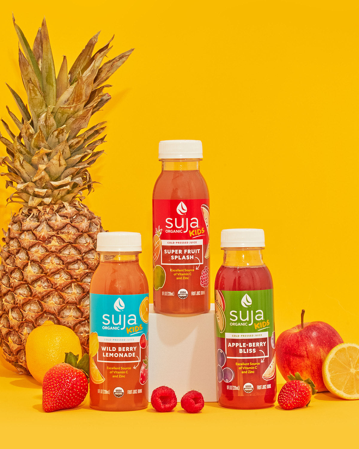 Suja kids bottles with pineapple and other fresh fruits
