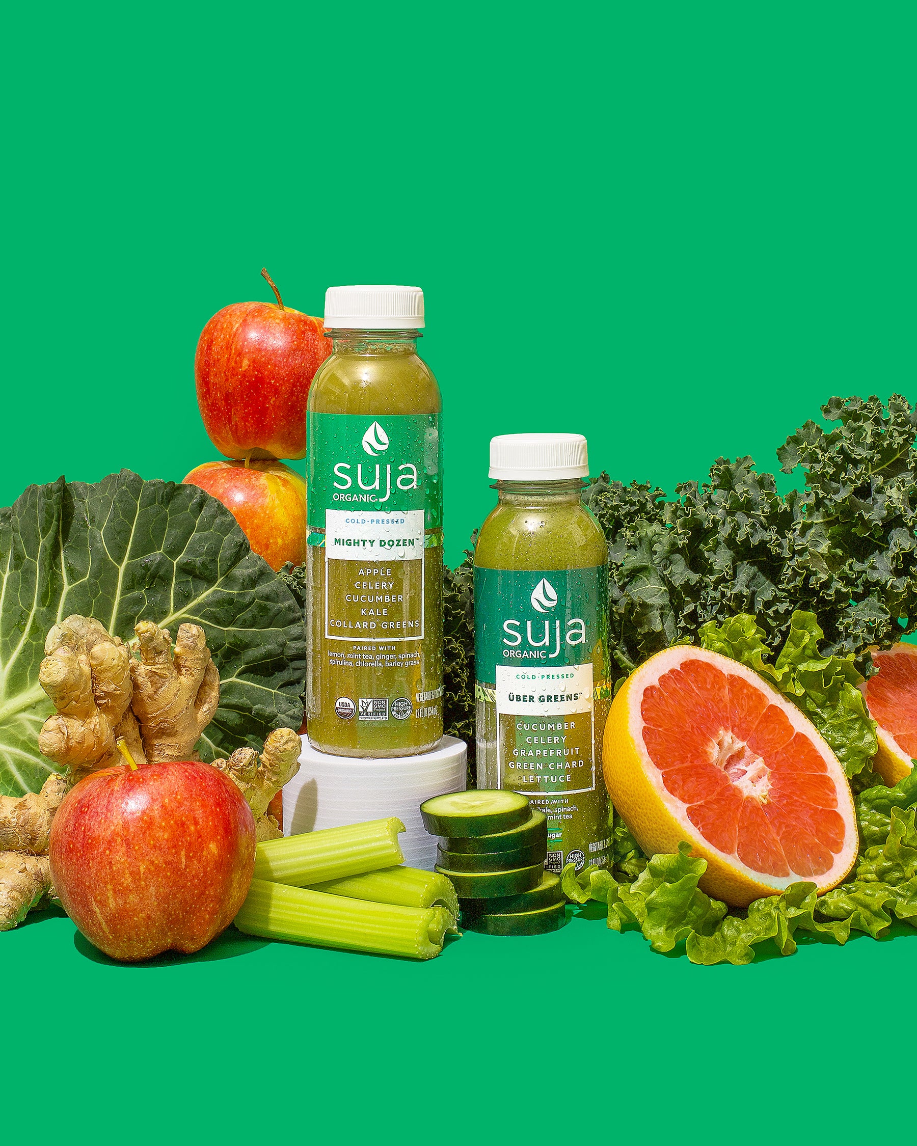 Suja bottles with spinach and other vegetables and fruit